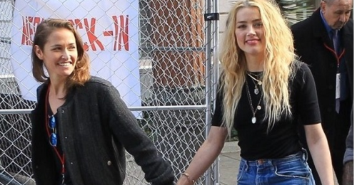 news Amber Heard, rumored girlfriend Bianca Butti hold hands at Women's Day March