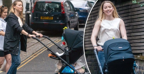 Amber Heard takes infant daughter for a stroll